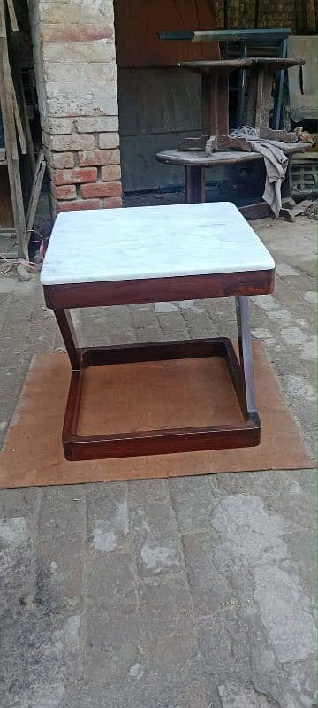 pure wooden table hai top py  marbel lga huva hai  hai 03418276657call 1