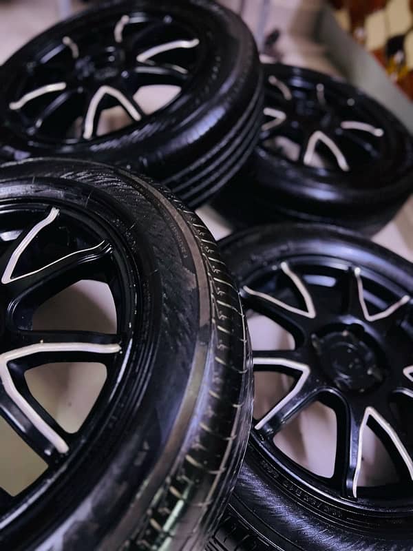 Yokohama 185/65 R15 (1.5 year warranty) with Alloy rims 4