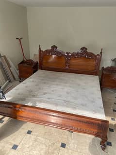 Wooden double bed with side tables and dressing table