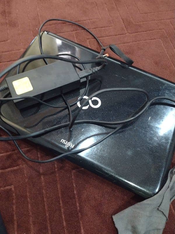 Fujitsu laptop with charger 14