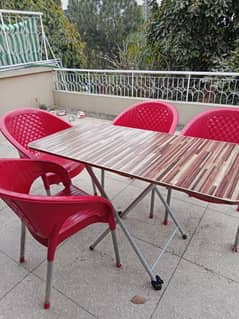 Wooden Dining table with 6 plastic chairs