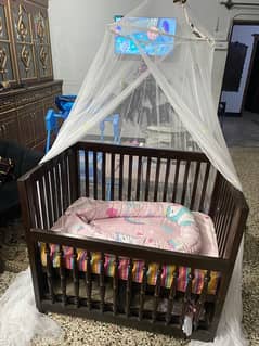 carry cot which I customised in solid wood