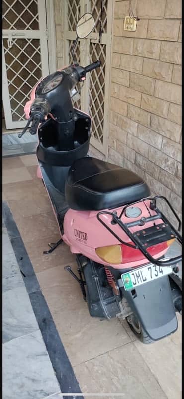 united scooty 80cc 4 stroke pink colour 1