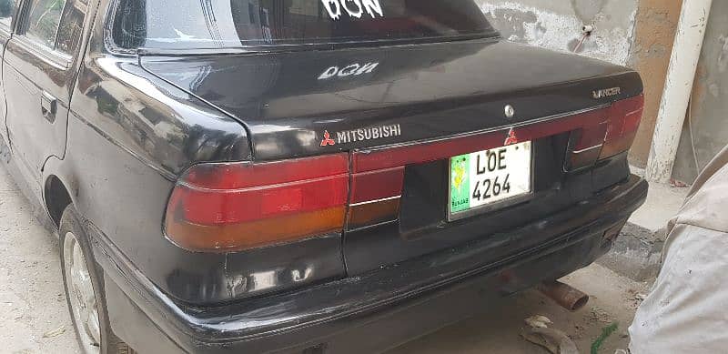 Mitsubishi Lancer 1990 axchaing bhi ho sakti hai 4