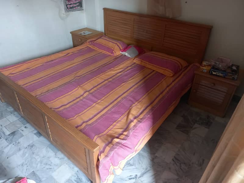 Wooden bed with side tables and wall mirror dressing 0