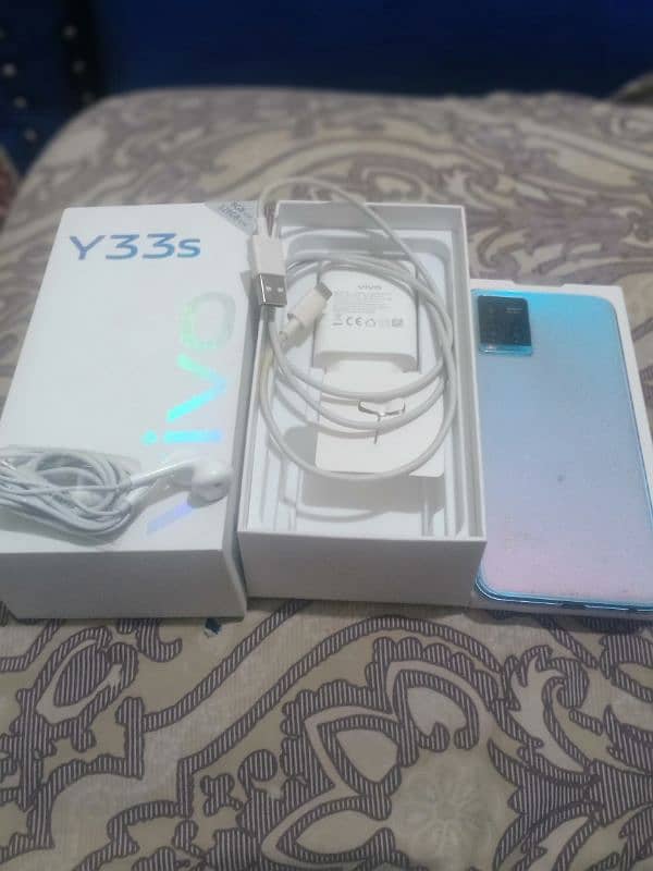 Vivo y33s 8+128 with Dabba charger & hand free 10/9 condition urgent 2