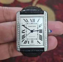 Cartier tank with after market diamond