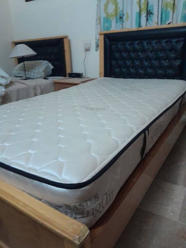 2 single wooden beds with spring mattresses 8