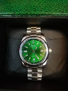 Attractive Rolex watch with green box