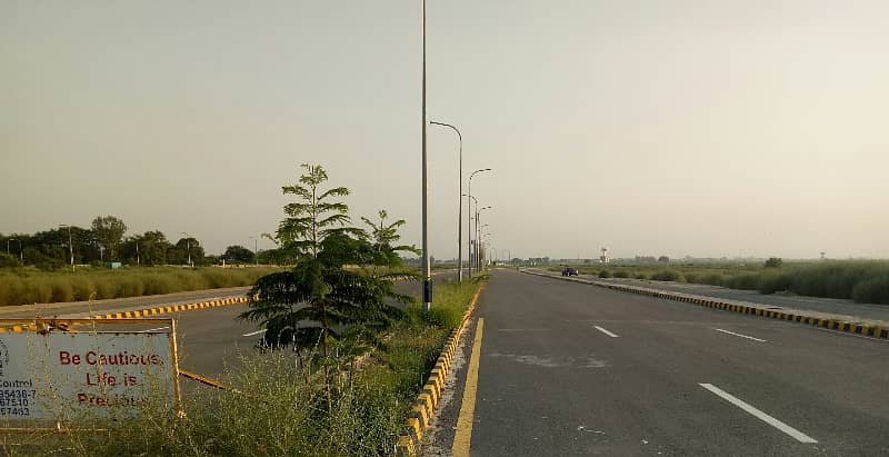 CORNER 150 FEET ROAD 1 KANAL PLOT IN DHA PHASE 9 PRISM FOR SALE BLOCK N 3