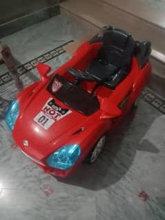 this is a kids car. its color is red. it is big size car.