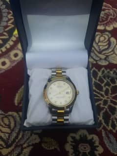 Gold and silver combination.  gold dial    fresh piece