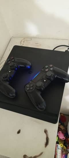 PS4 Playstation Slim 1tb with 2x Controllers + Taken 7