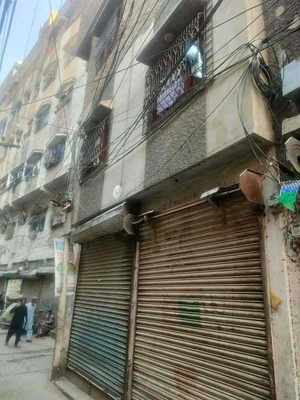 3 side corner building for sale ground 4 shops plus 4 floors with roof 19