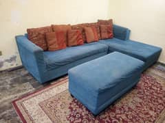 sofa with foot stool table