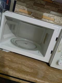 microwave oven , used but new condition