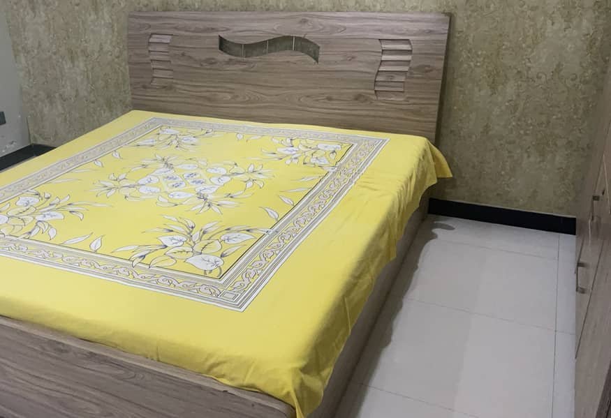 Bed with wardrobe set wooden color for sale. 0