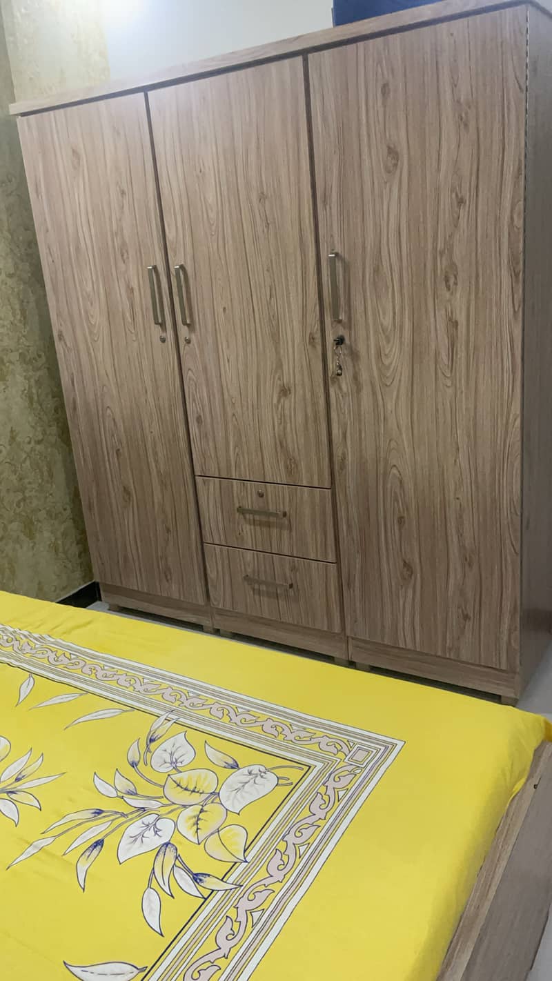 Bed with wardrobe set wooden color for sale. 1