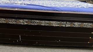 Dark brown wooden bed