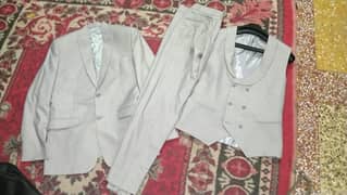 grey 3pice suit+ pink shirt and pocket rumal