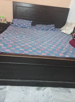 Double bed with side table and matress