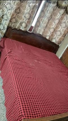 wooden double bed with mattress