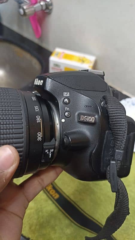 Nikon D5100 with 70-300 lens and bag and card 10