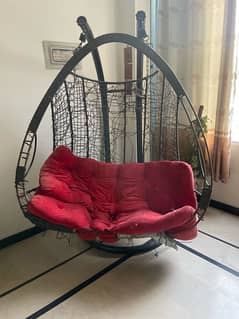 Home double seater with red cushion and hook meta swing