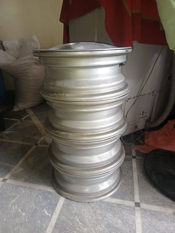 brand new Suzuki cultus original company rims with wheel cup 0