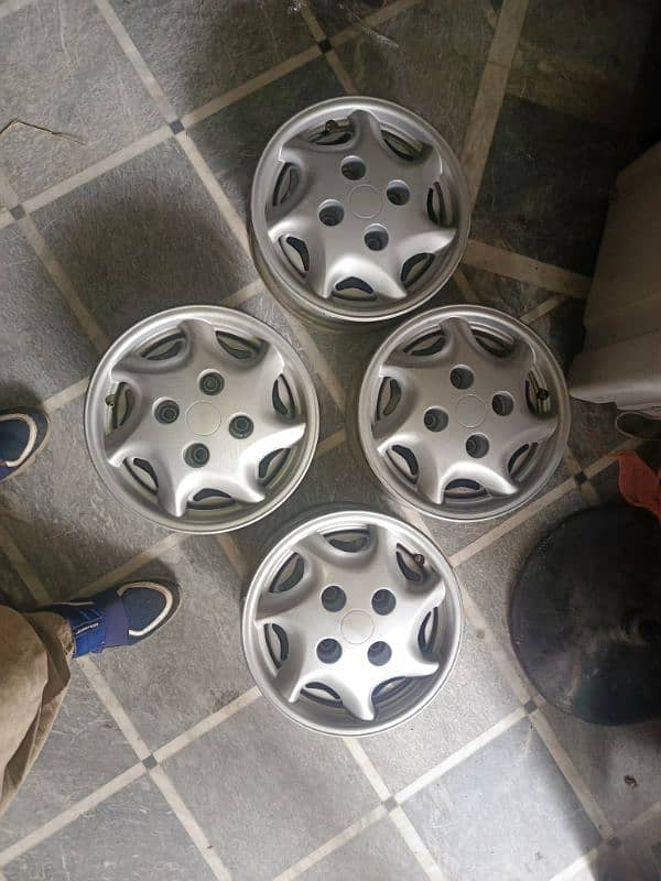 brand new Suzuki cultus original company rims with wheel cup 2