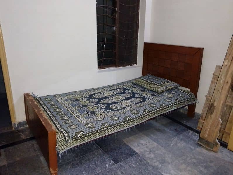 single wooden bed 1