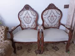 2 chairs with round table