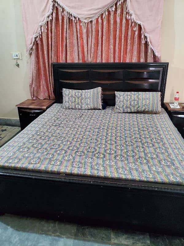 wooden bed black color good condition 0