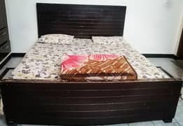 Wodden bed with mattress and cover