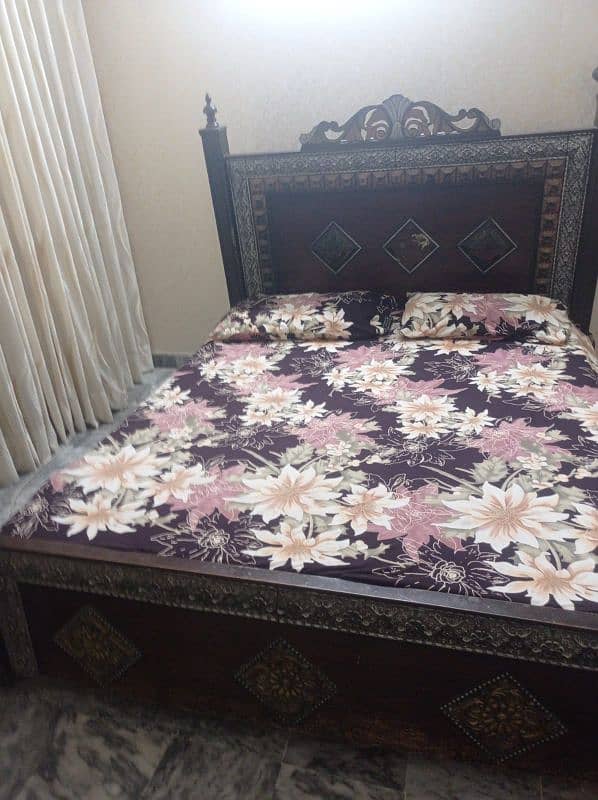 wooden bed available without mattress If U,r interested plz contact 0