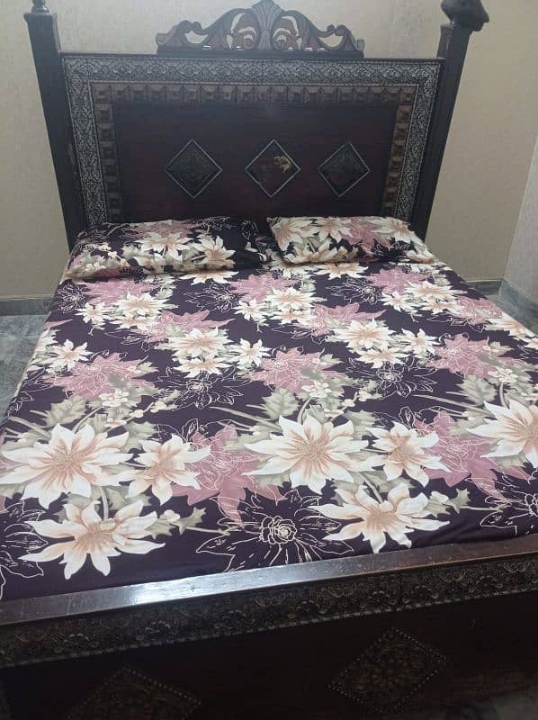 wooden bed available without mattress If U,r interested plz contact 1