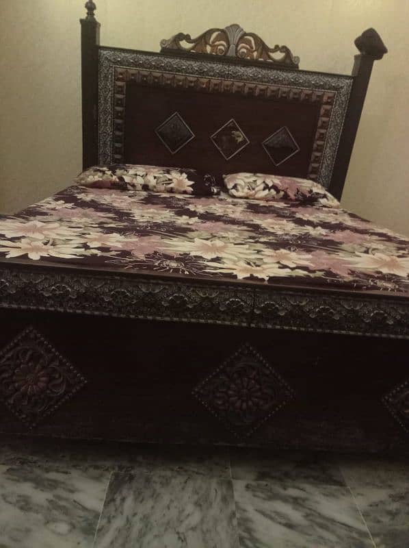 wooden bed available without mattress If U,r interested plz contact 2