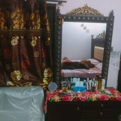 Almaari Bed and cosmetics table