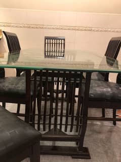 Elegant glass top dining table 6 seater