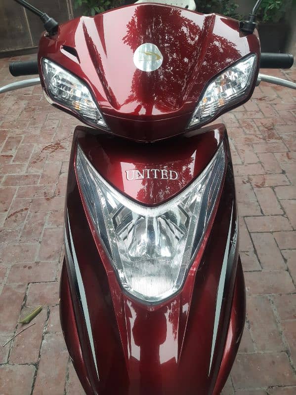 united scooty 100cc 0