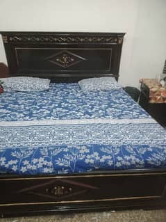 6 months used , wooden bed with side tables