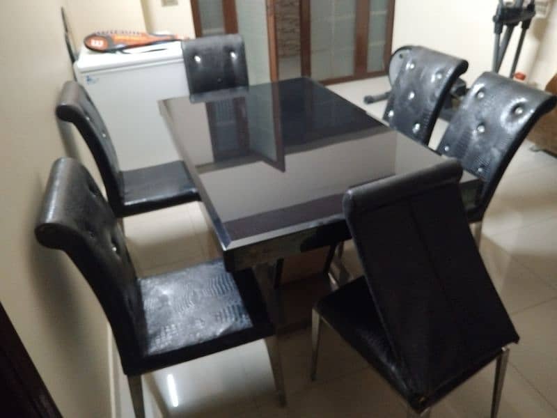 dining table for sale ss and glass top 1