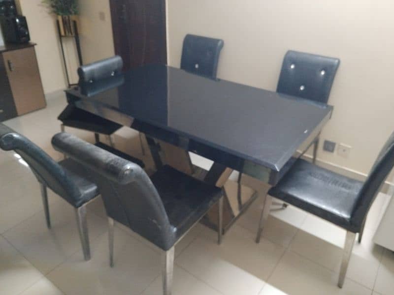 dining table for sale ss and glass top 3