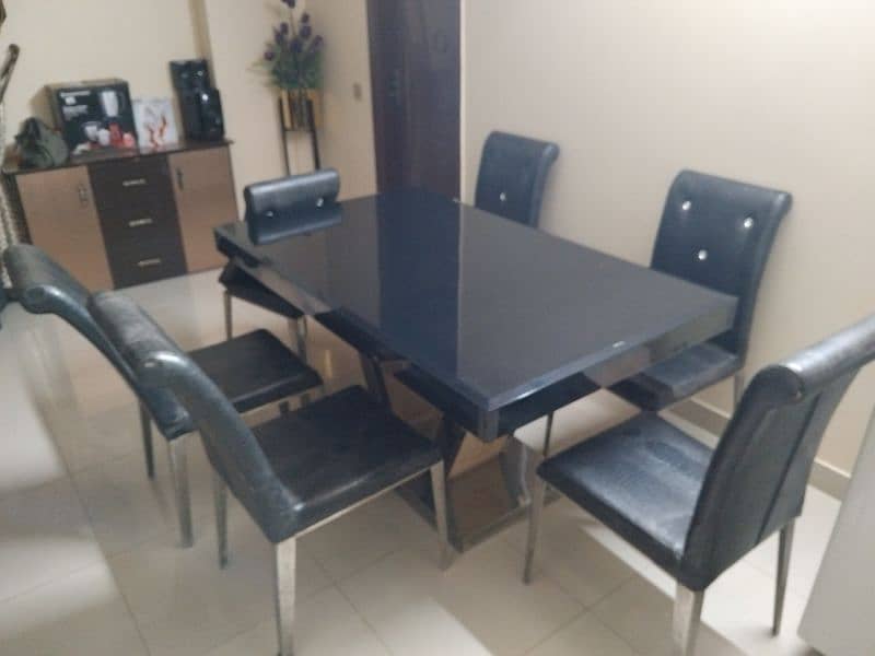 dining table for sale ss and glass top 4