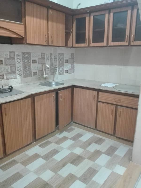 two bed lounge tile flooring apartment for rent in johar 0