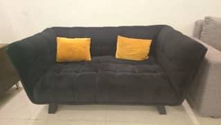 Pair of elegant two-seater sofas in black