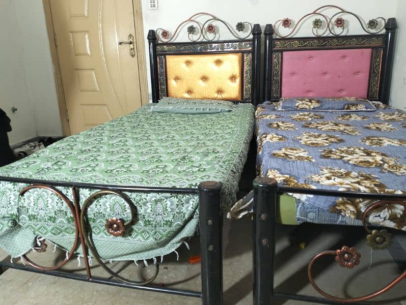 two single iron beds . . Rs. 18000 2