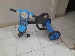 kid tricycle in blue colour