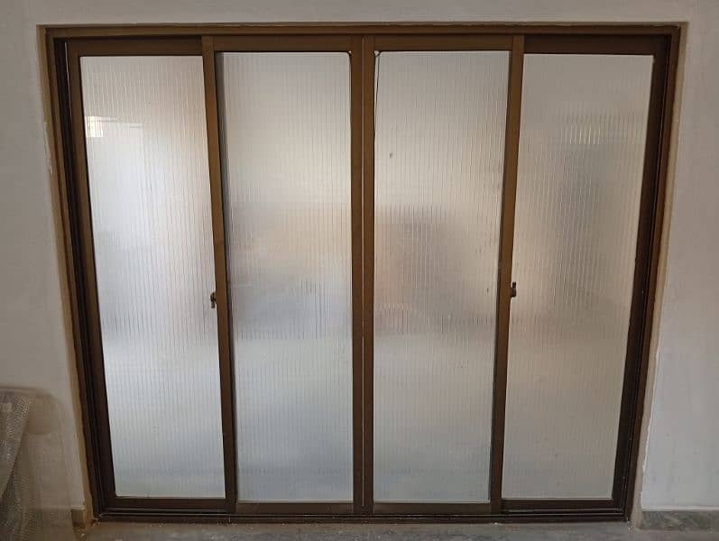 ALMUNIUM PANEL SLIDING DOOR 1