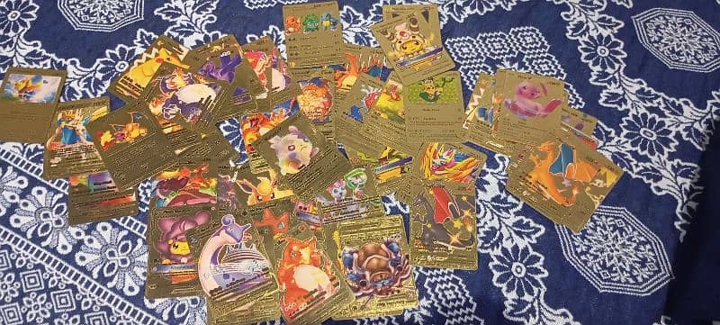 54 pcs new condition golden pokemon cards. 3